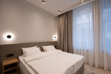 Interior of a hotel bedroom with master bed