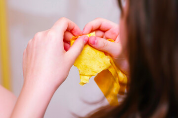 Child's hands holding a piece of cheese pita bread