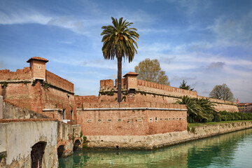 Livorno, Tuscany, Italy: the ancient fortress surrounded by a navigable moat, in the historic center of the city - 707326668