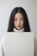 Woman Holding White Paper With Long Black Hair