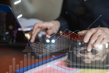 Businesswoman working on mobile devices in the office.