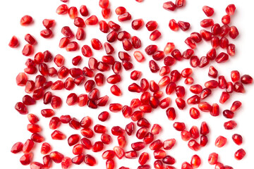 Pomegranate grains on white isolated top view