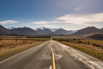 Highway through the valley to the snow caped southern alps