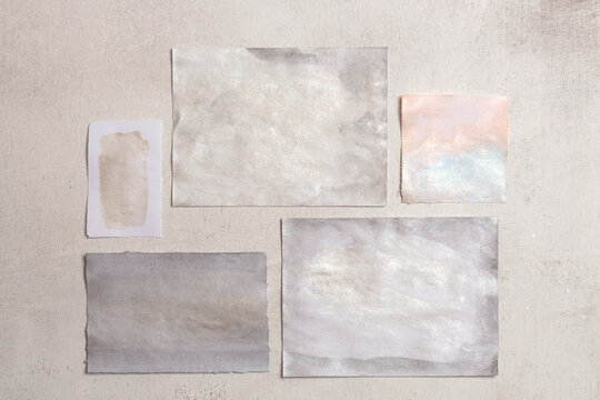 Beige and nacre gold, silver frame painting paper empty card blank on wood wall. Abstract texture copy space neutral grunge background.
