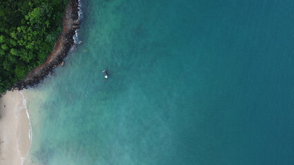 Drone capture of beautiful beach and boat in rumassala sri lanka.
