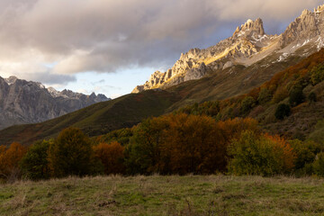 Fototapeta na wymiar Peaks of Europe national park in northern Spain Cantabrian mountains during autumn at sunset with bright colorful leaves