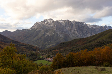 Peaks of Europe national park in northern Spain Cantabrian mountains during autumn at sunset with bright colorful leaves