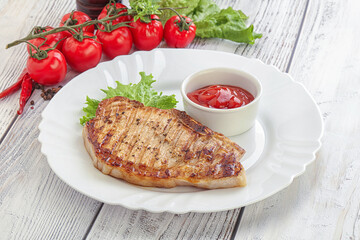 Grilled pork steak with ketchup