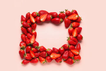 Frame made of fresh strawberries on pink background
