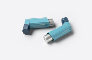 Asthma inhalers on grey background
