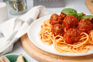 Plate of boiled pasta with tomato sauce and meat balls, closeup