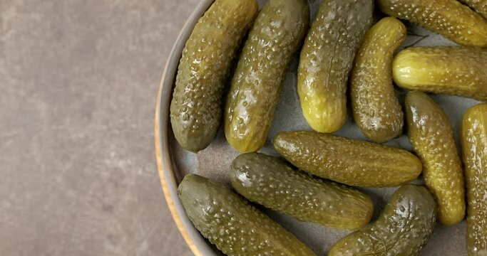 Close-up of pickled or salted cucumbers background, copy space