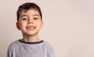 cute preschool boy with one milk teeth missing.smiling child close up face. Loss of primary teeth, replacement with permanent ones. Children's dentistry concept.