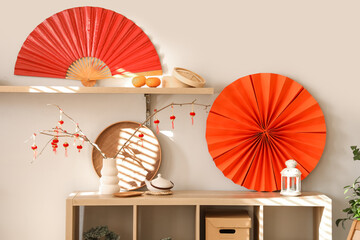 Shelving unit with traditional decorations for Chinese New Year celebration in living room