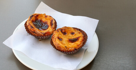 Portuguese Custard Tarts on Plate. Concept of Dessert