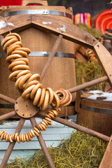 Folk decorations for the Maslenitsa holiday. the steering wheels are hanging on the wheel, seeing...