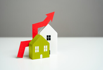 Houses and red arrow up. Growing demand, construction rates and trends. Rising housing prices....