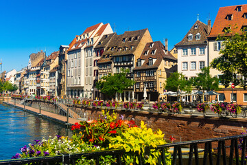 Scenic summer cityscape of old town of Strasbourg with half-timbered houses on canals, Alsace,...