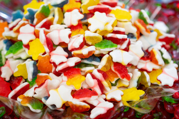 Colorful gummy candies on the counter in a candy shop
