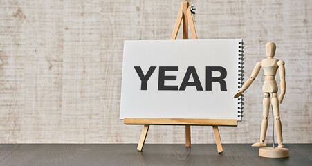 There is wood block with the word YEAR. It is as an eye-catching image.