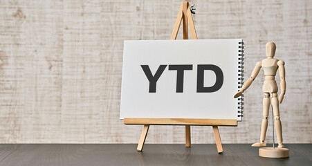 There is wood block with the word YTD. It is an abbreviation for Year to date as eye-catching image.