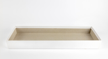 An empty rectangular white cardboard box. Layout for design and advertising. Gift box on a white...