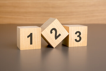 123 text on wooden cubes. wooden background. foreground - obrazy, fototapety, plakaty