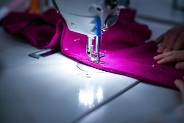 Working in the tailor shop. Creative workshop for children. Sewing machine close up. 