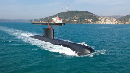 Navy submarine underway full speed on the calm waters of the Bosphorus, waving the Turkish flag....