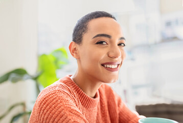 Cheerful millennial pretty latin woman enjoy peace and free time, in cafe, office interior, sun flare
