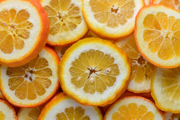 juicy oranges cut into circles as a background 3