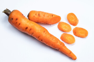 Fresh carrots and pieces isolated on white background as package design elements