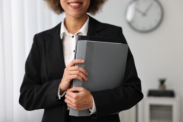 Notary with folders in office, closeup view