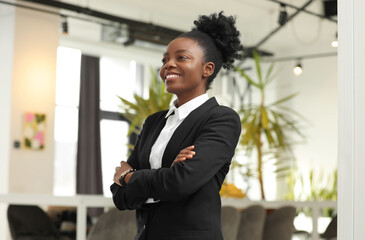 Happy woman with crossed arms in office. Lawyer, businesswoman, accountant or manager