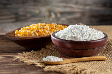 Fototapeta na wymiar Maize starch. Cornstarch in the bowl and corn kernels.