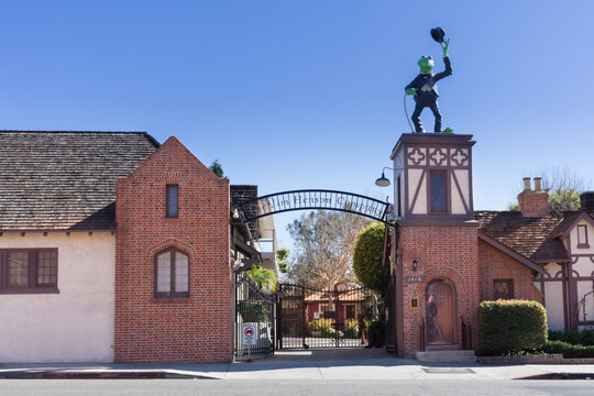 Los Angeles, CA - USA: The historic Charlie Chaplin Studios on La Brea Ave. Now the Jim Henson Co. Formerly A&M Records. Showing brick entrance, large Kermit, and gate with logo.