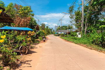 Country road through the small village of Ban Tin Rei on the island of Ko Jum. The small main road led across the entire island from the northern Ko Pu to the southern village of Ban Ko Jum