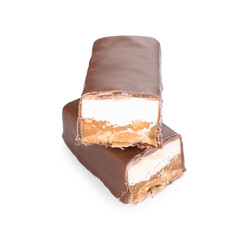 Pieces of tasty chocolate bars with nougat and nuts on white background