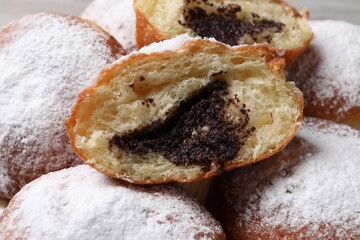 Delicious sweet buns with poppy seeds, closeup
