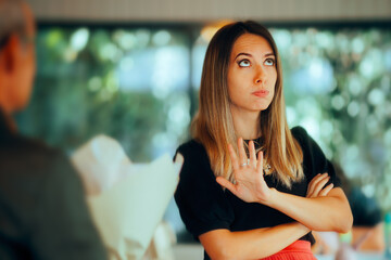 Woman Refusing a Flower Bouquet from an Unwanted Suitor. Upset unforgiving girl not accepting the...