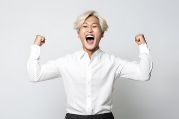 Portrait of an excited young asian man isolated on white background