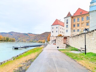 Fototapeta na wymiar Austria Durnstein old historical buildings along Rhine river and Danube river 