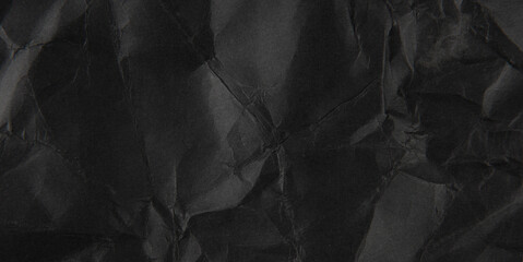 crumpled black paper texture background.
