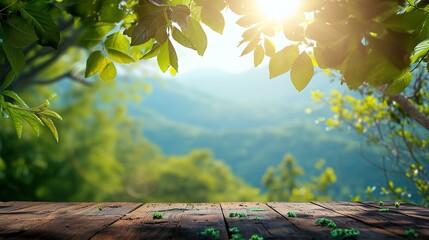 table background of free space for your decoration and blurred landscape of mountains.Blue sky with sun light and green small leaves