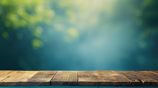 Wood table top on blue abstract green from garden in the morning background.For montage product display or design key