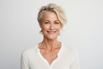Mature woman with blond hair. Portrait of smiling mature woman.