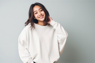 Portrait of a beautiful young asian woman in white hoodie - Powered by Adobe