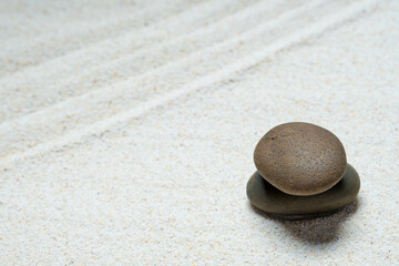 Fototapeta na wymiar Top view of three stones resting on sandstone balance concept, Japanese Zen garden