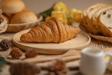 Croissants on a wooden plate