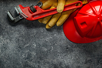 Big Monkey Wrench Working Gloves And Helmet Construction Concept.